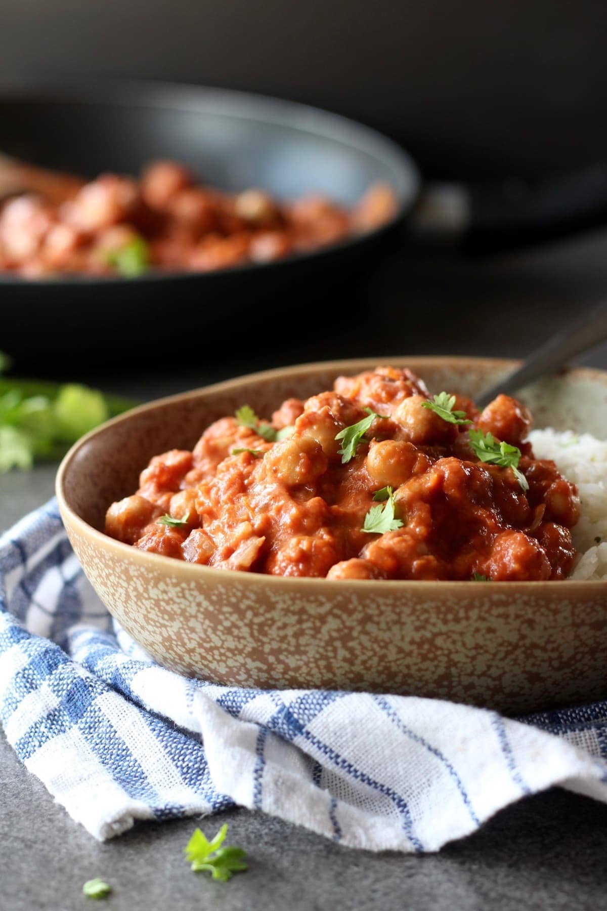 a bowl piled high with vegan chickpea tikka masala