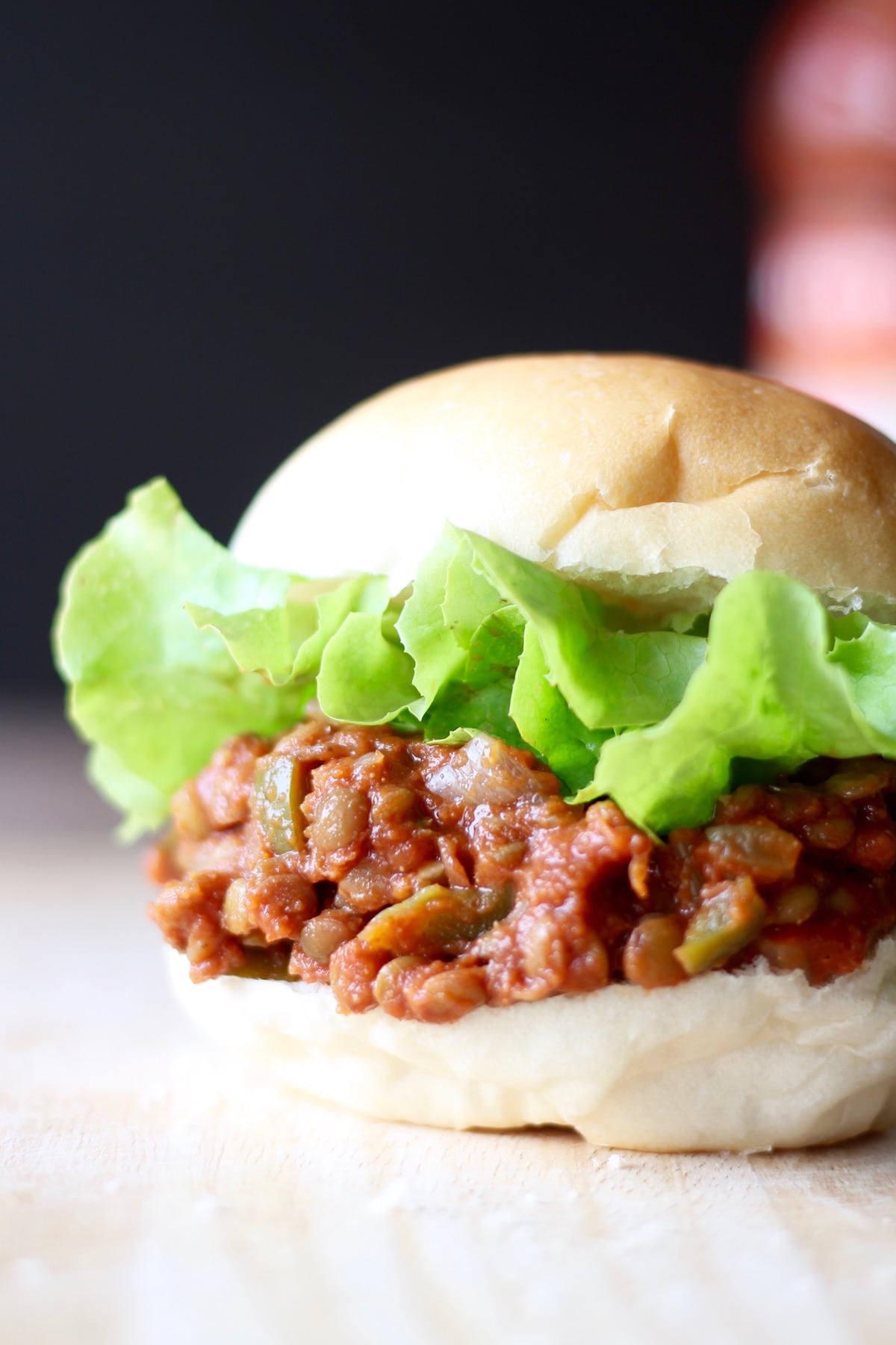 a close up of a lentil sloppy joe sandwich