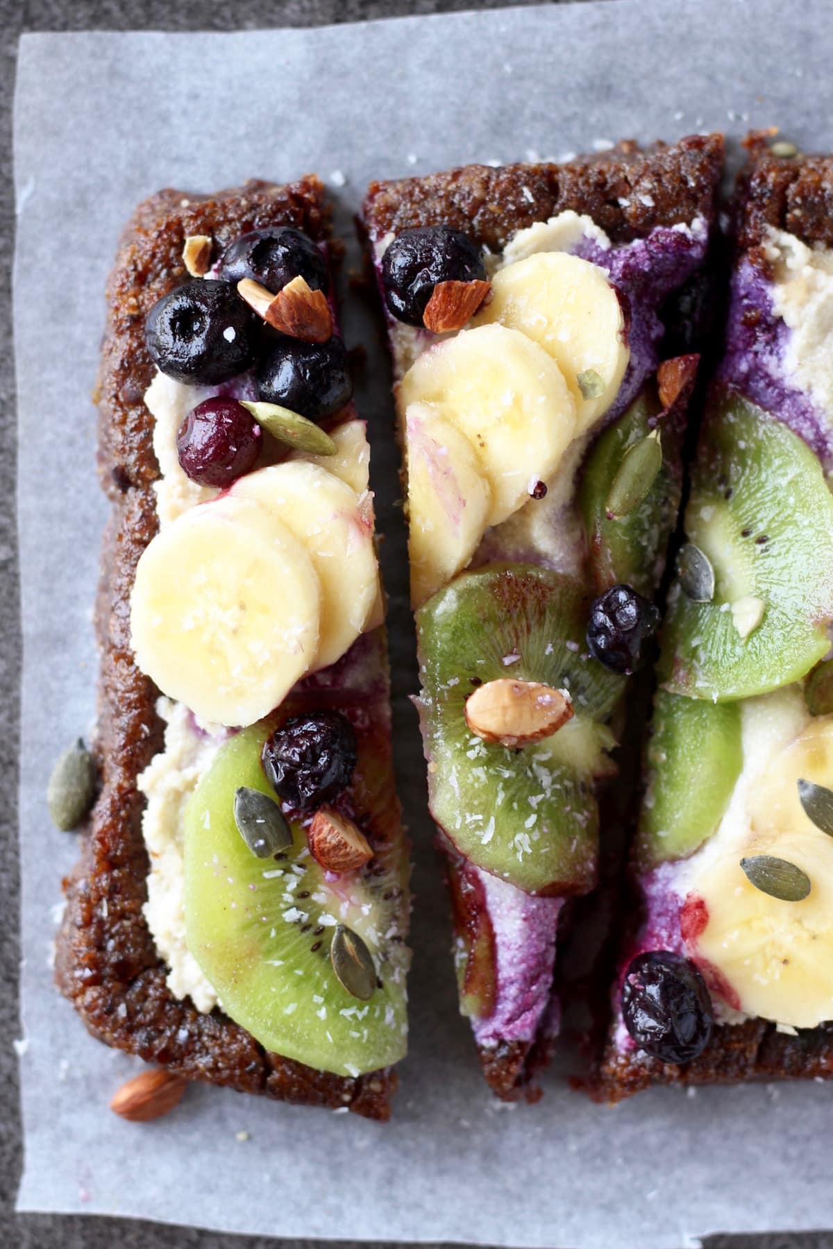 raw fruit pizza sliced into strips