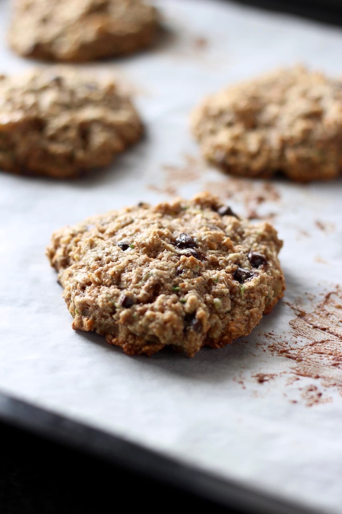 golden brown zucchini oatmeal cookies on a baking tray