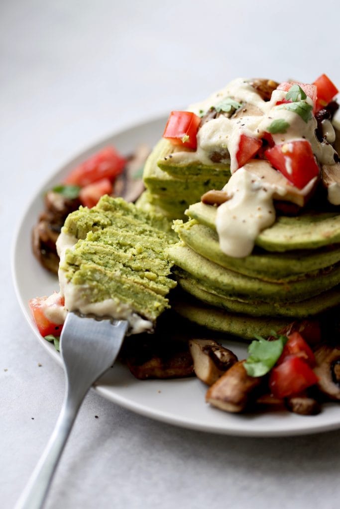 a stack of my savory chickpea flour falafel pancakes on a plate
