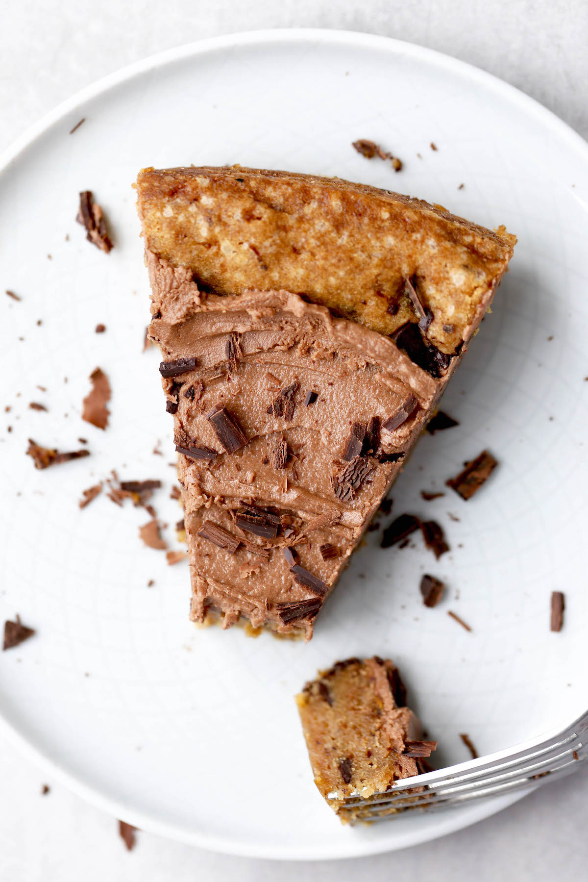 chocolate shavings decorating the top of a slice of cookie cake