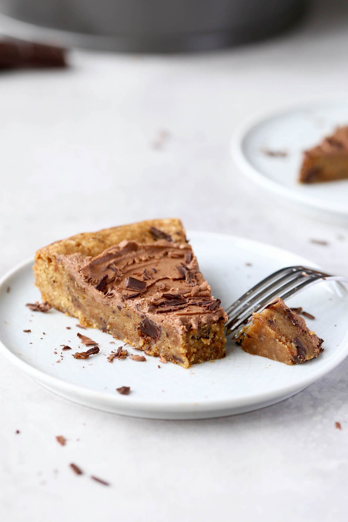 a piece of cookie cake being cut into