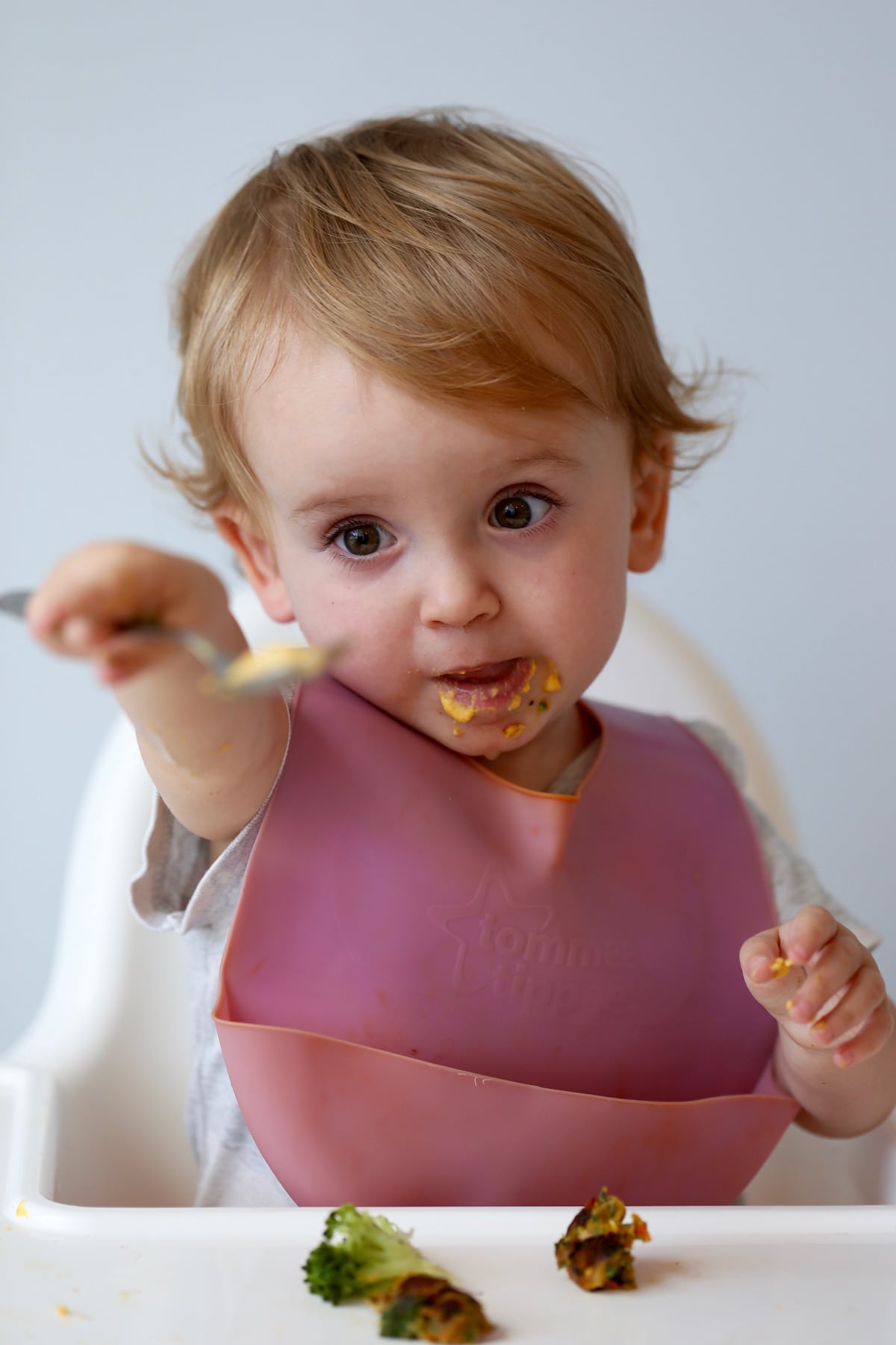 a little girl sharing her hummus with me