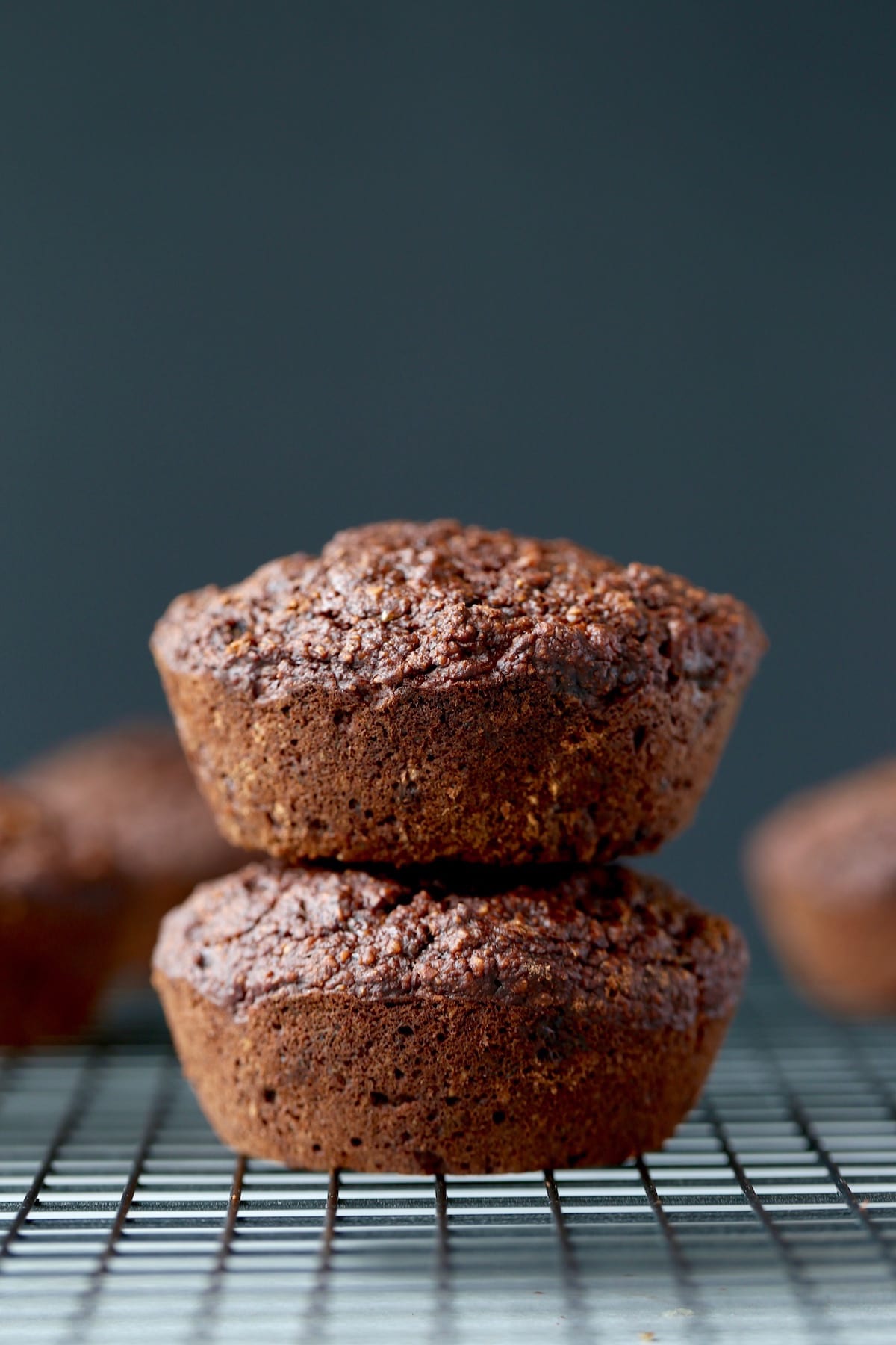 two jumbo vegan chocolate muffins stacked on each other