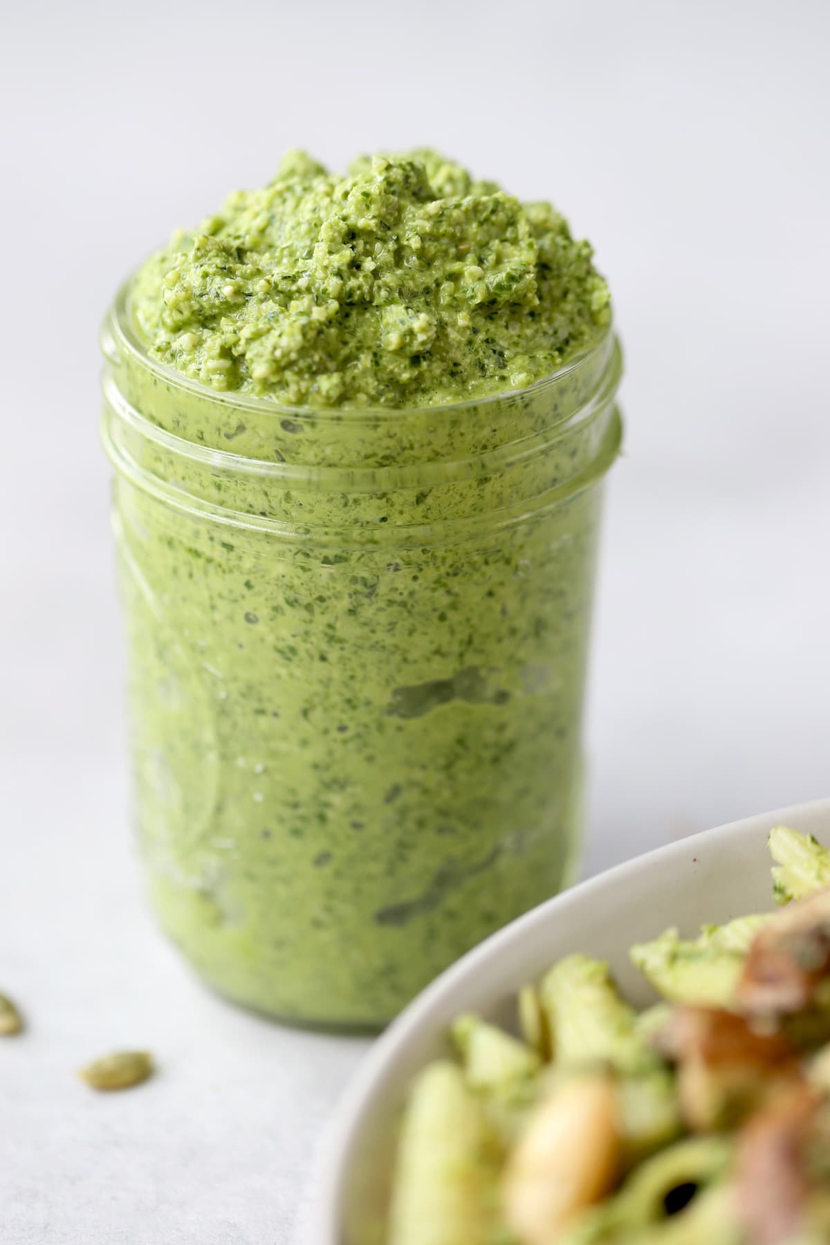 pesto pasta piled high in a ball jar