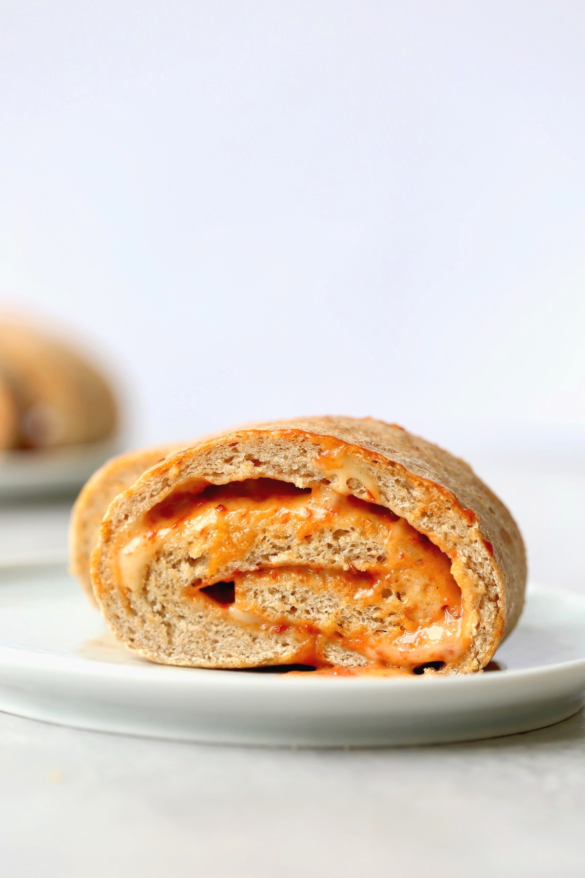 a swirled slice of cheesy pizza bread