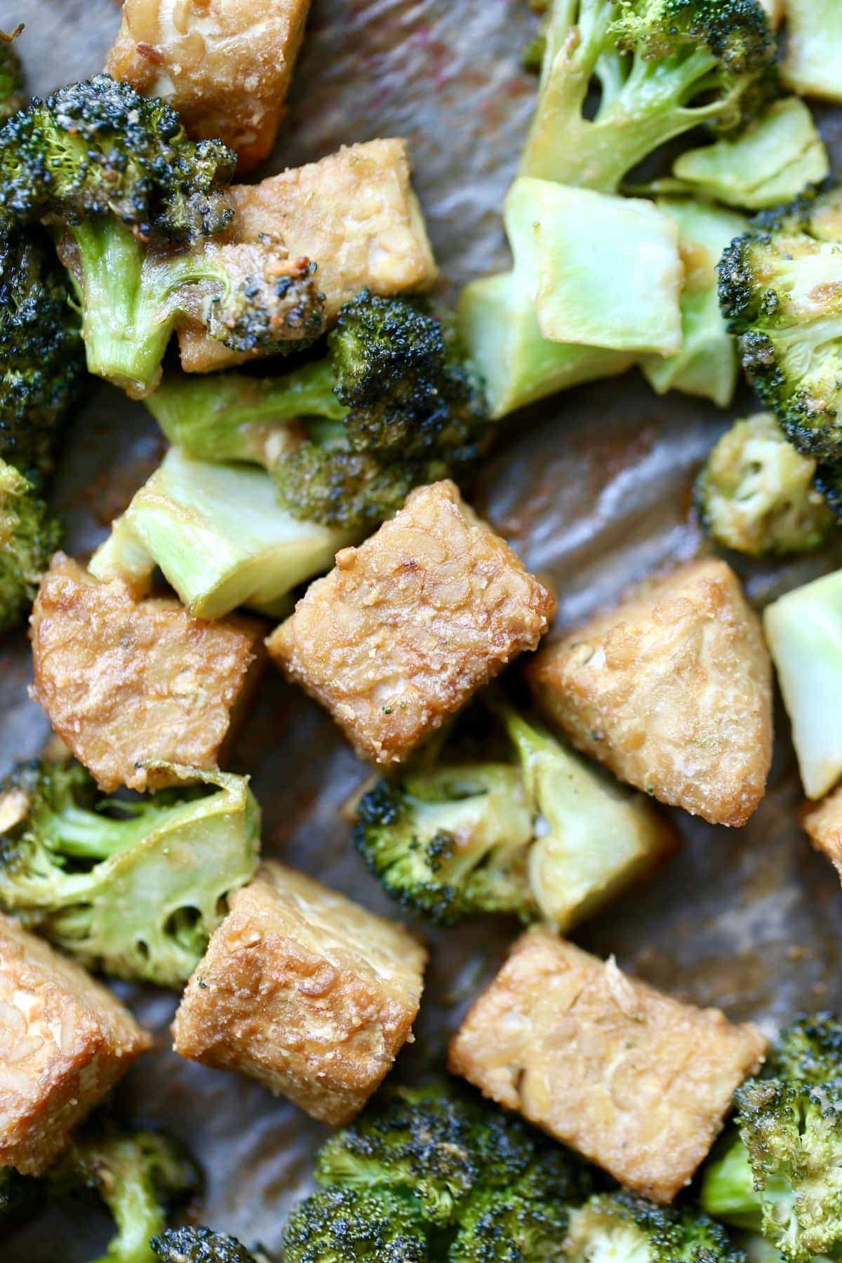 roasted tempeh and broccoli on a sheet pan