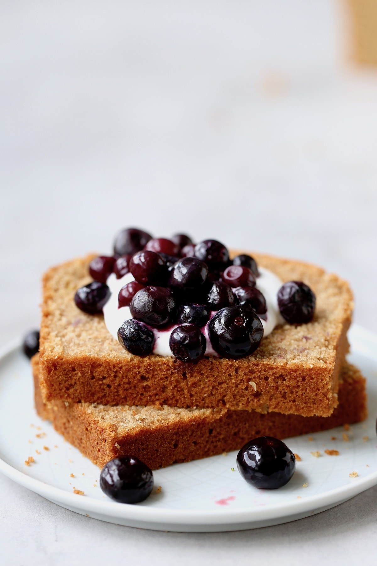 slices of Whole Wheat Olive Oil Tea Cake topped with blueberry
