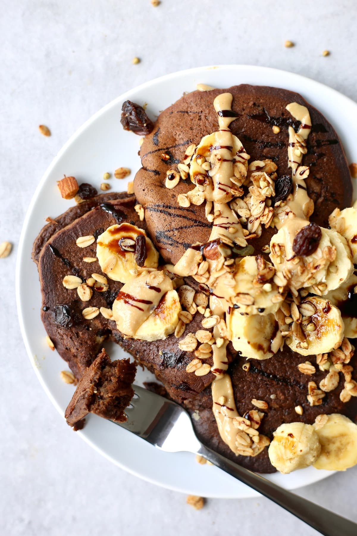 a fork full of chocolate chickpea flour pancakes