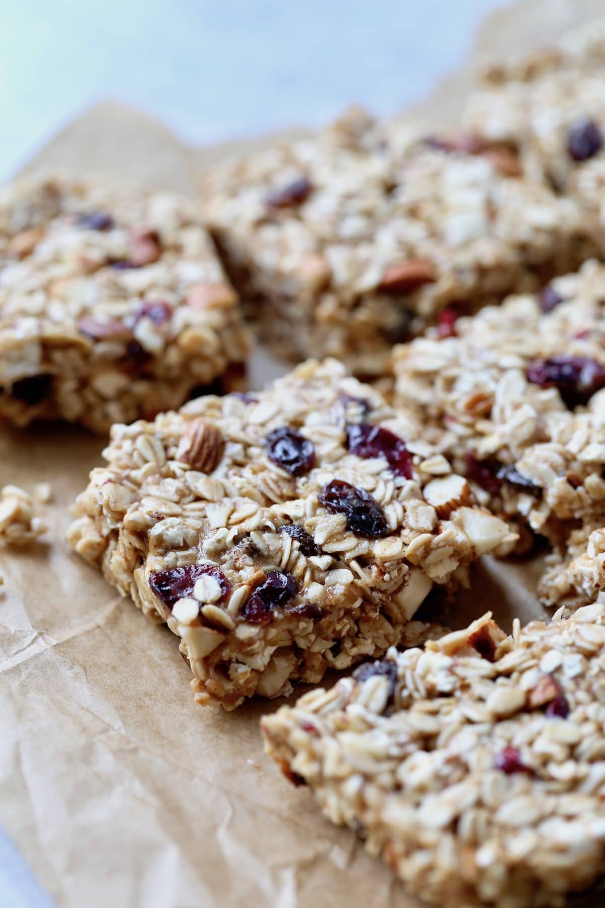 chewy popcorn granola bars cut up on parchment paper