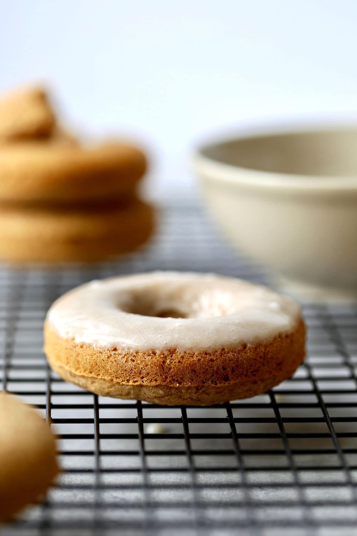 freshly baked chai donuts with glaze on top