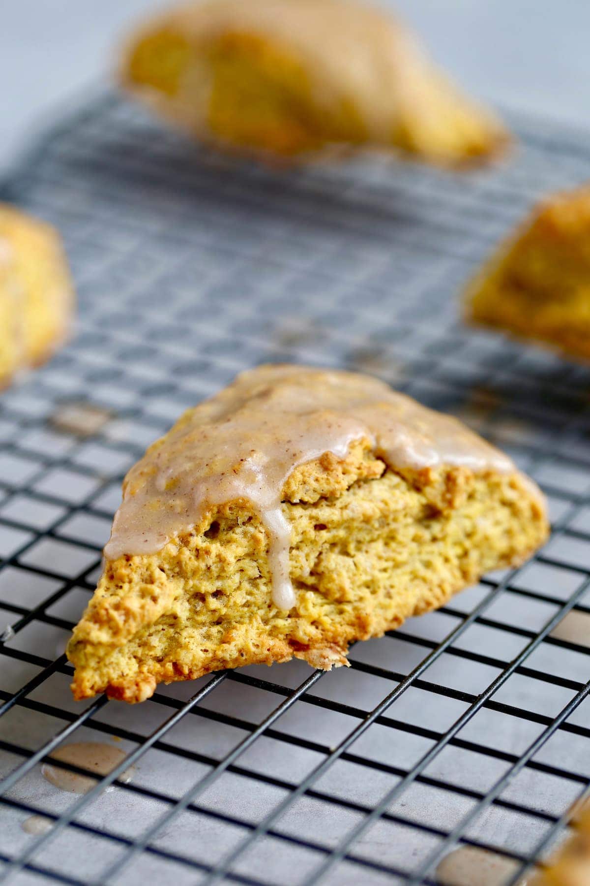 Glazed Pumpkin Scone on a wire rack