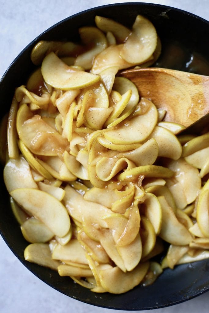 sauteed cinnamon and brown sugar apples in a pan