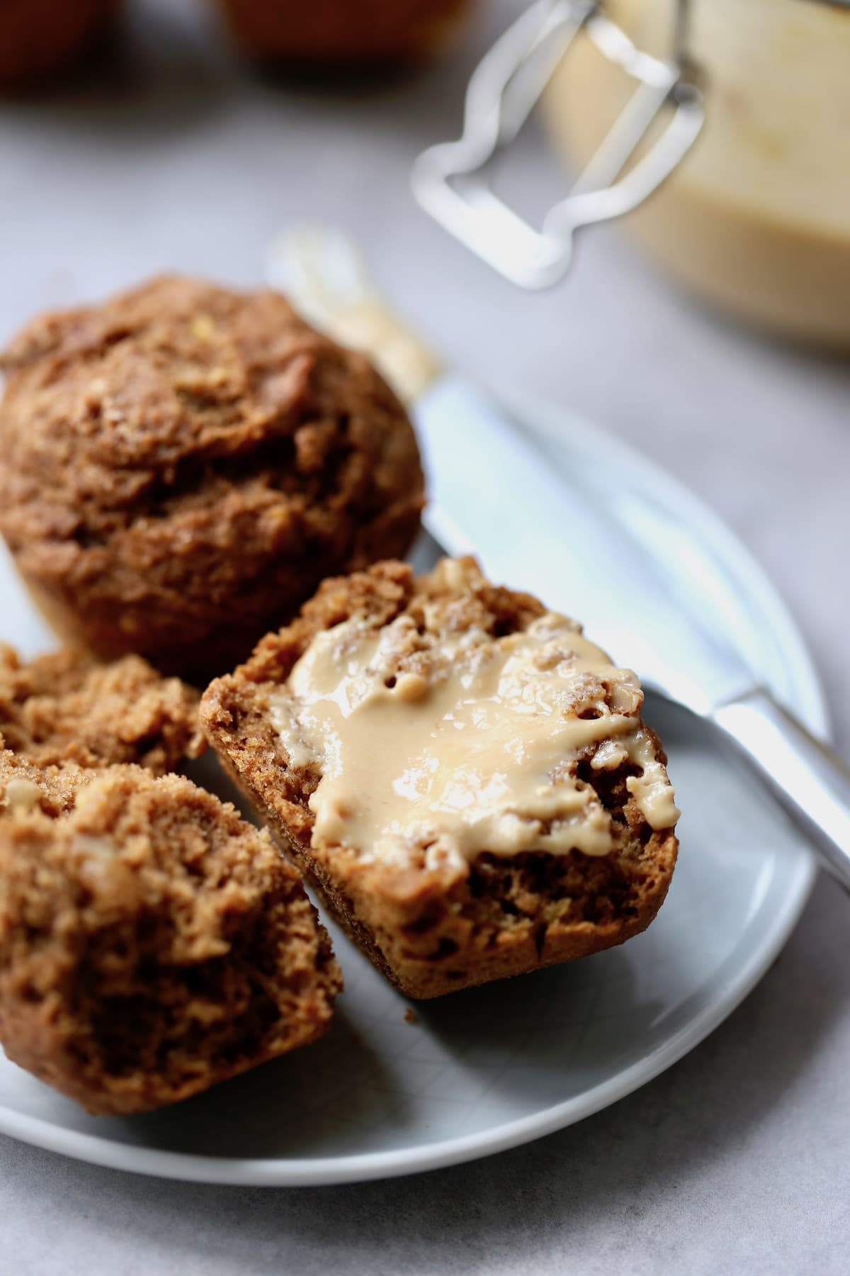 peanut butter smeared on a banana nut muffins