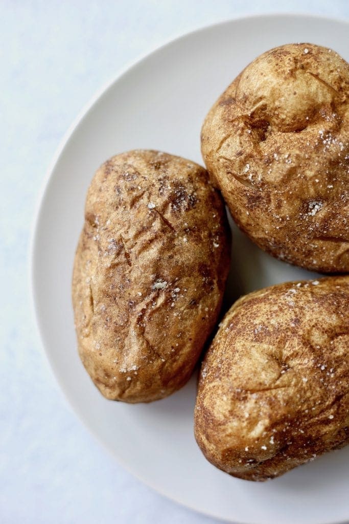 salted baked potatoes on a plate