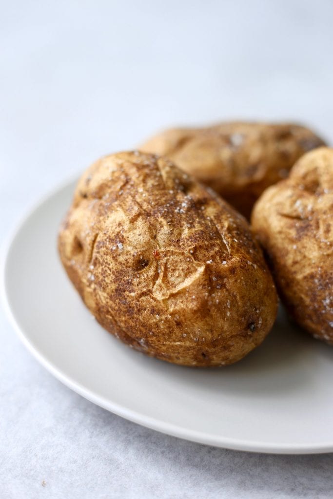 a golden brown baked potato on a plate