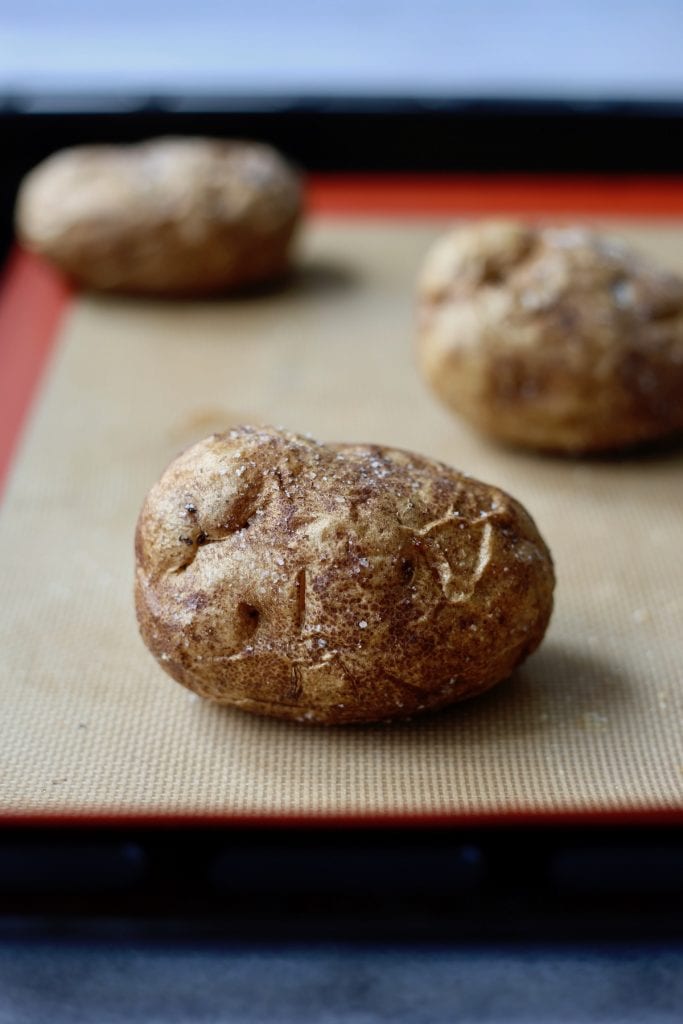 a perfectly baked potato on a silicone baking mat