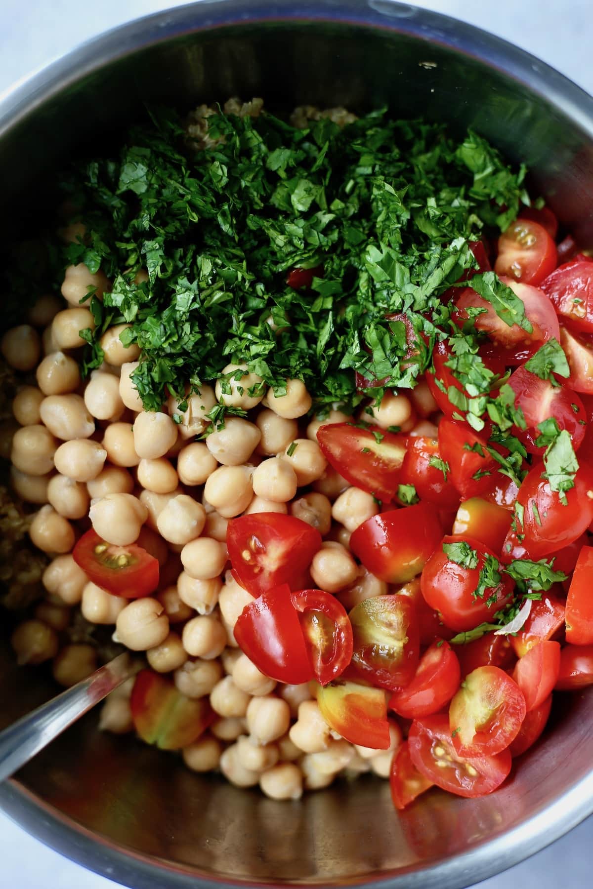 chickpeas, cherry tomatoes and chopped cilantro in a pot