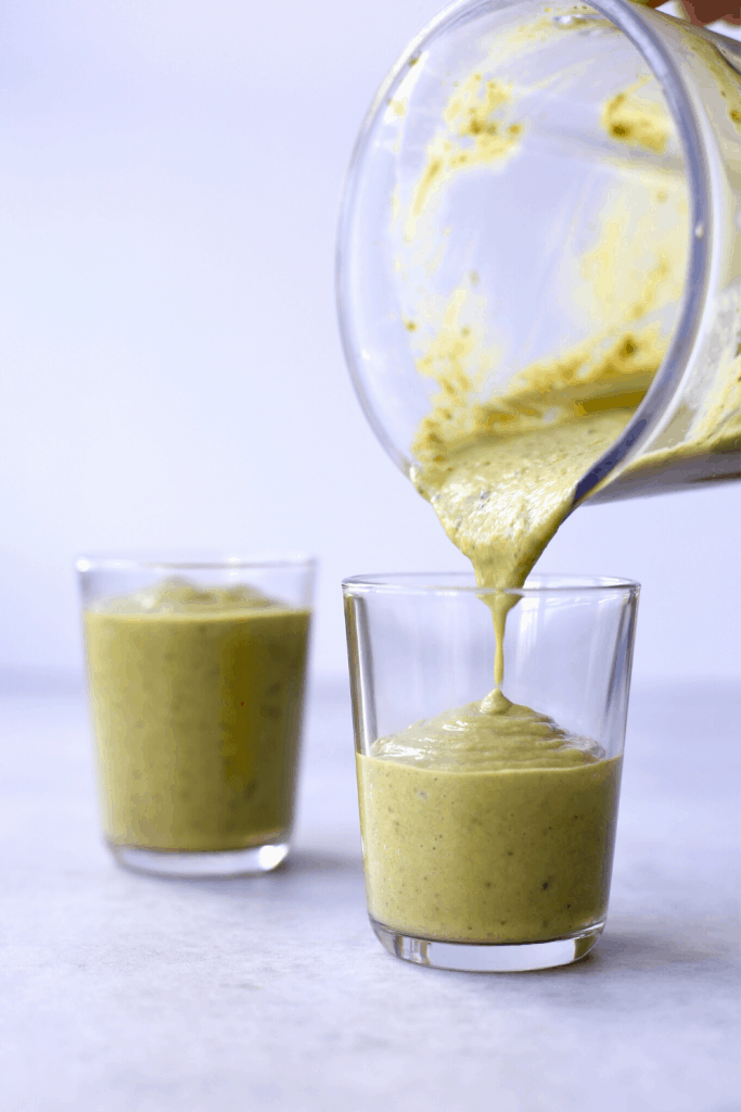 a vegan shamrock shake being poured into glasses