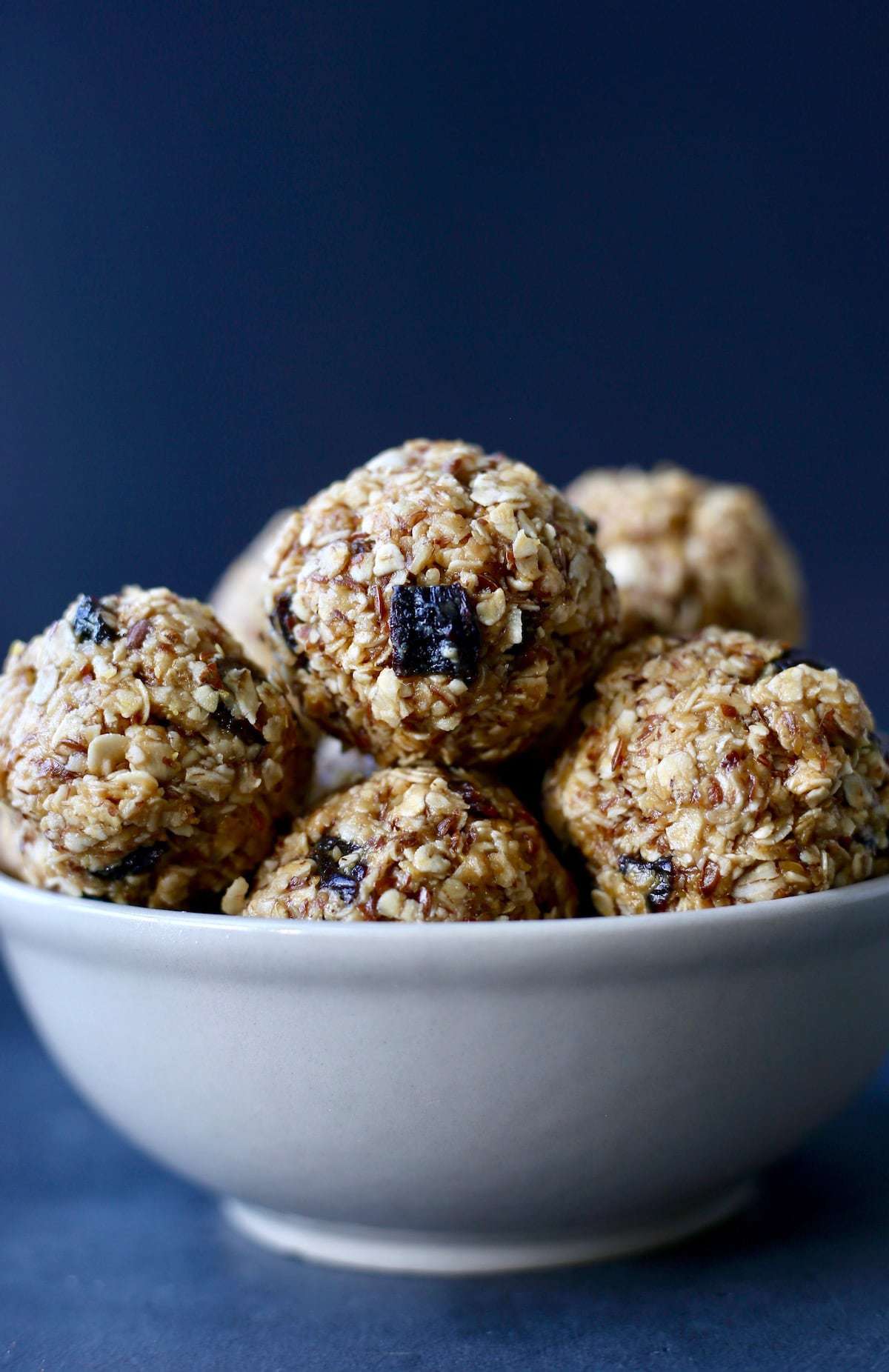 A blue backdrop helps highlight orange energy bites