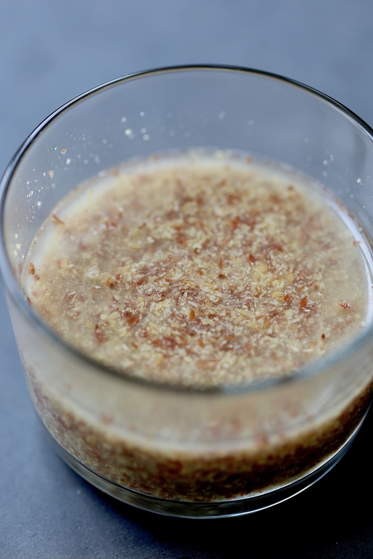 a flax egg thickening in a glass bowl