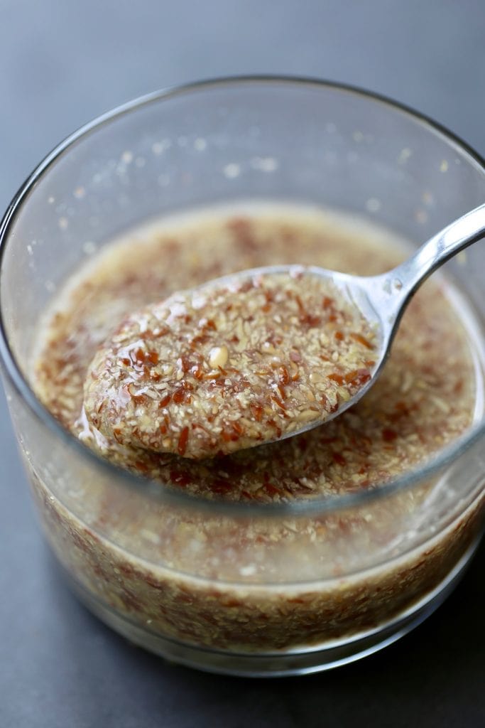 a thickened flax egg being scooped up with a spoon