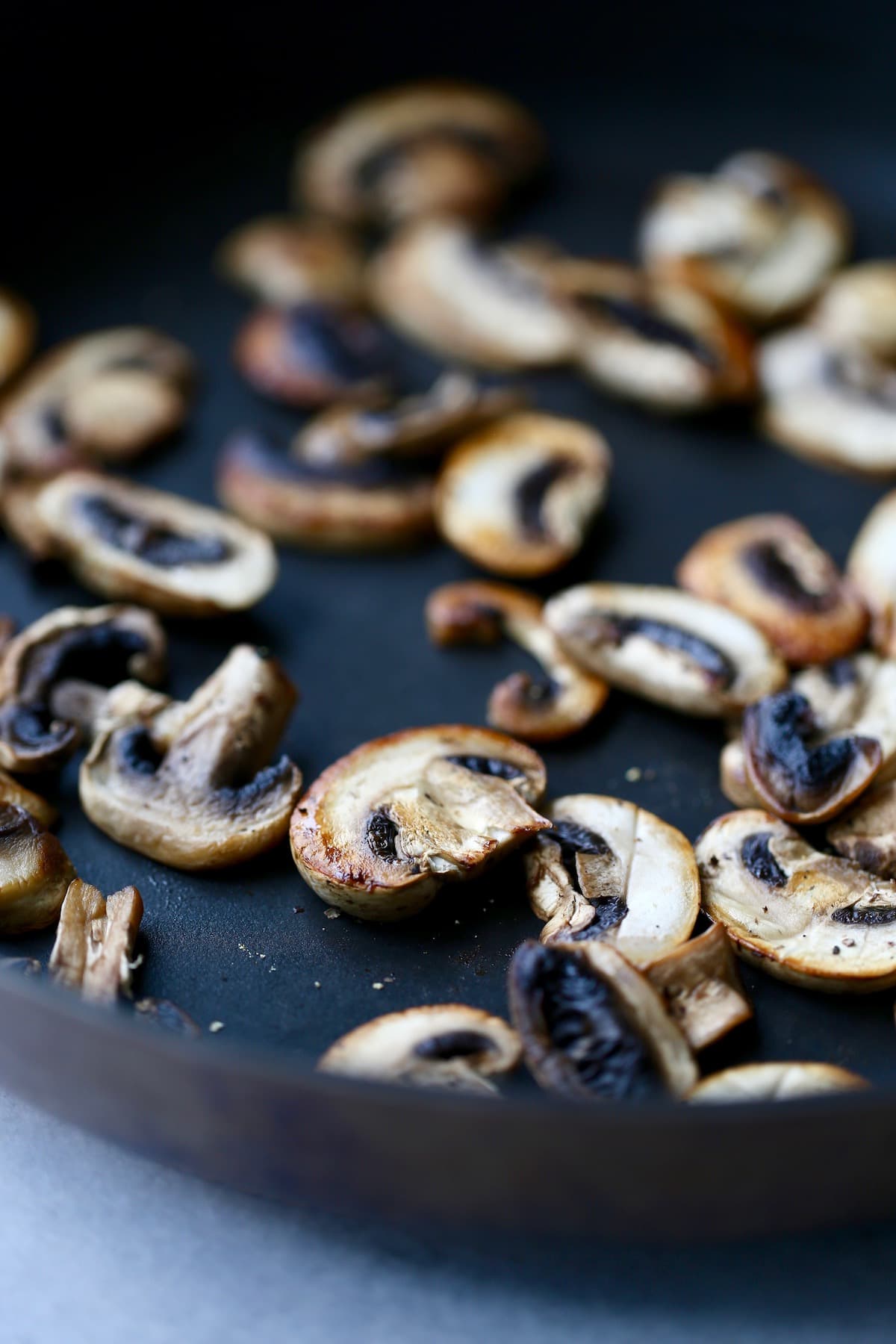 Mushrooms browning on a saute pan