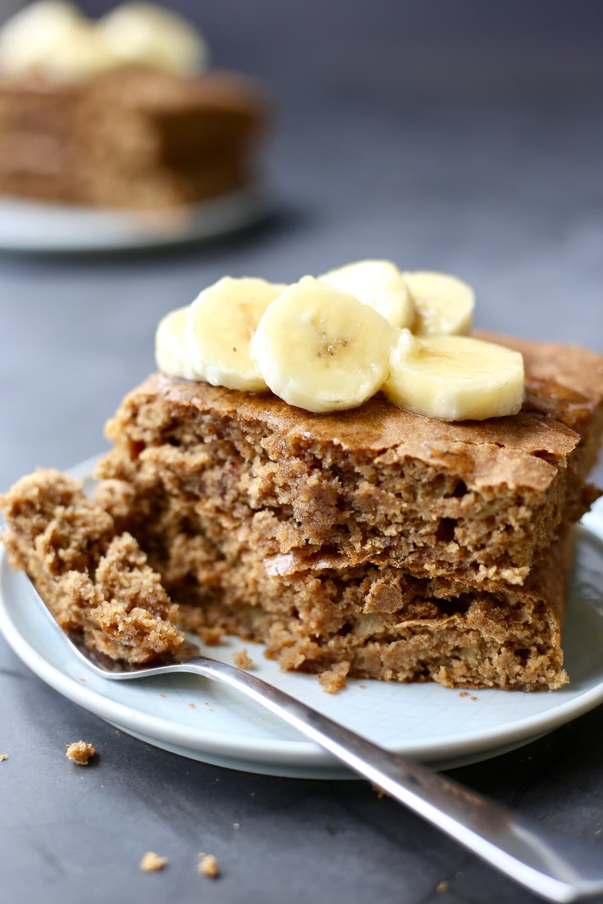 Sheet pan vegan banana pancakes stacked on a plate