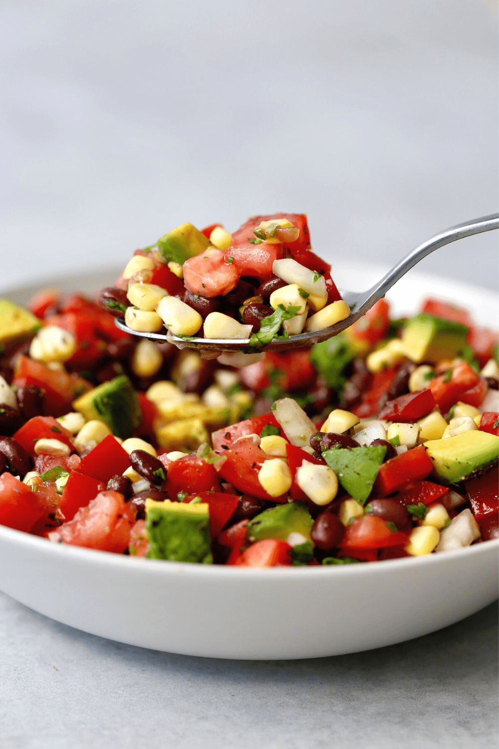 a spoonful of Simple Black Bean and Corn Salad