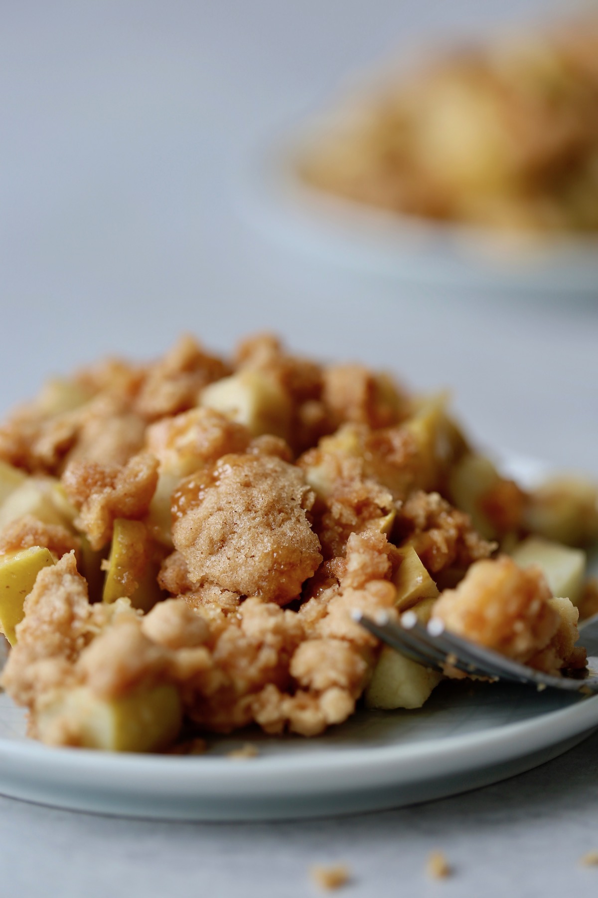 a close up of the golden brown topping on apple dump cake