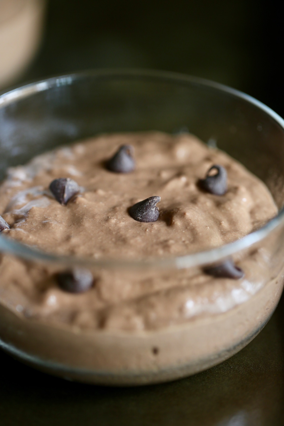 the batter for tiktok chocolate baked oats with protein before baking in a single-serve ramekin