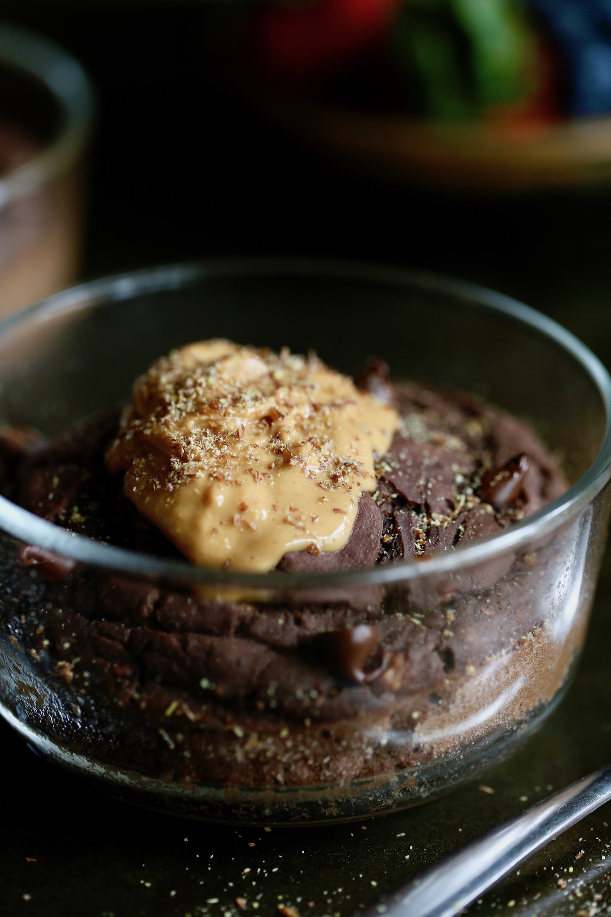 chocolate baked oats topped with peanut butter and ground flaxseed