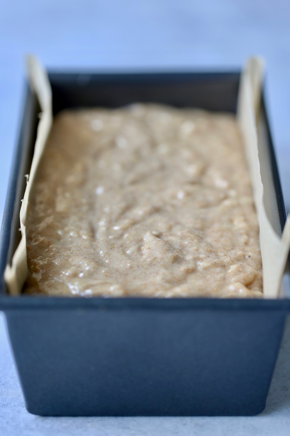 banana bread batter in a loaf pan before baking