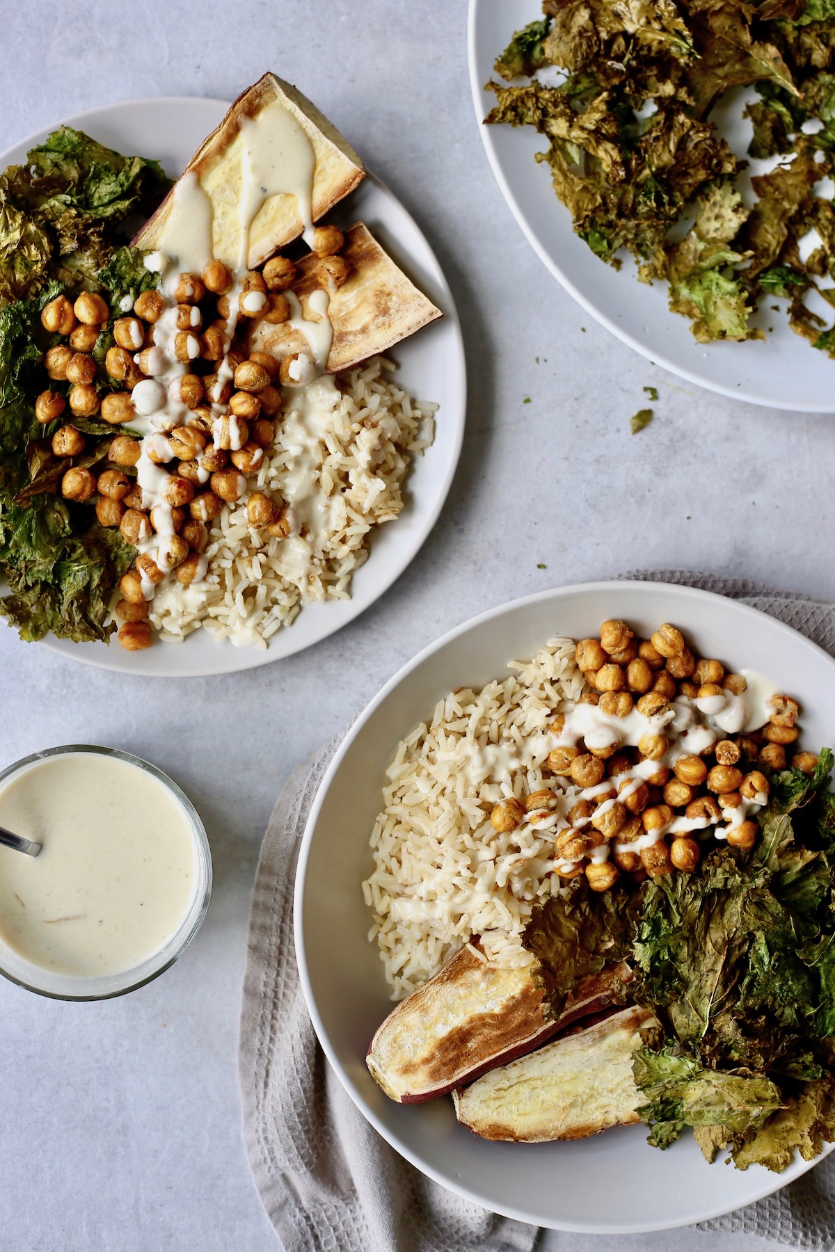 Buddha bowls with crispy kale, oven roasted crispy chickpeas and tahini dressing