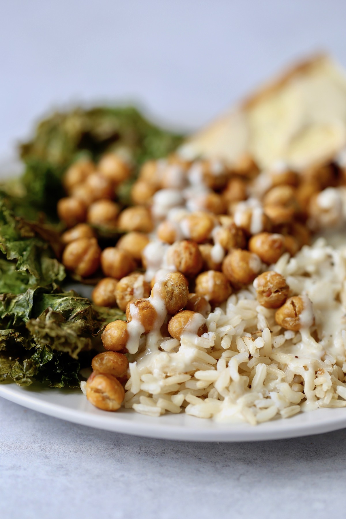 crispy chickpeas over brown rice with lemon tahini dressing