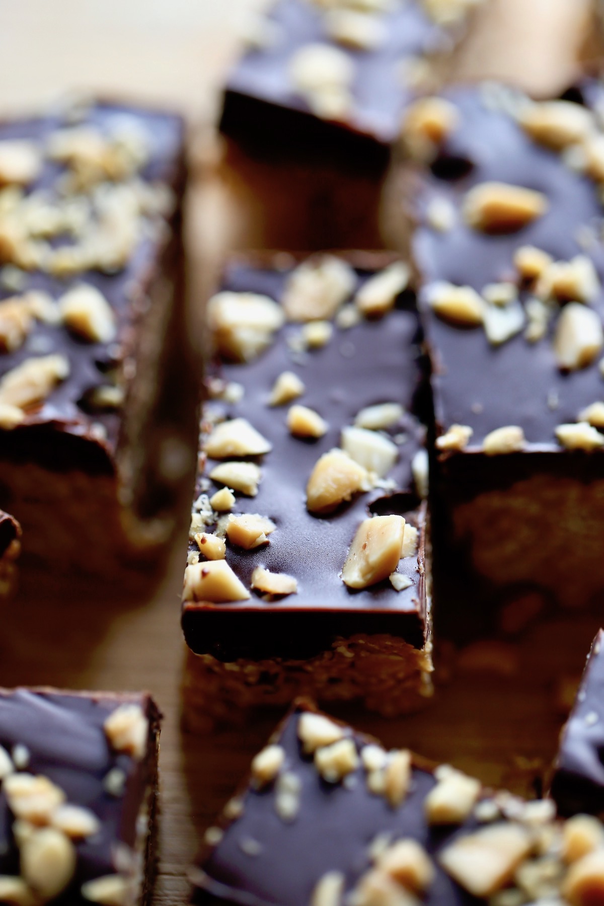 healthier peanut butter bars cut up on a cutting board