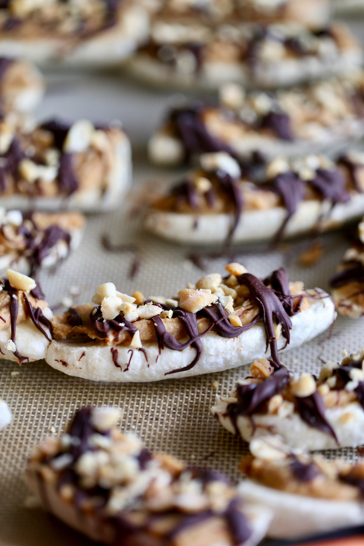 healthy frozen banana snickers on a baking sheet