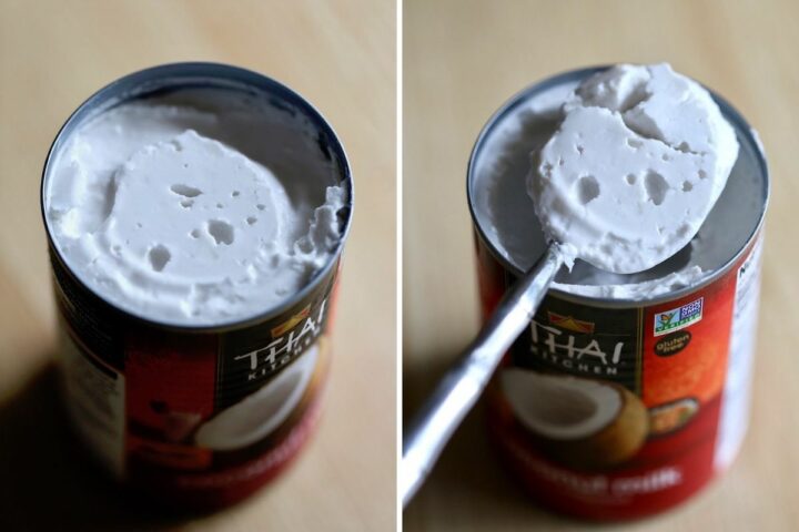 thick coconut cream being scooped out of a can of full-fat coconut milk