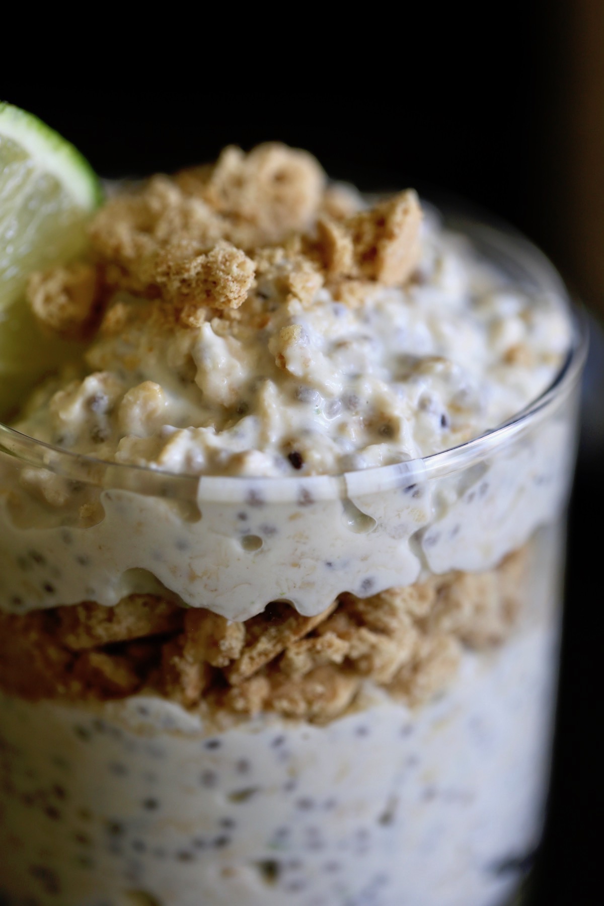 A close-up of Key Lime Pie Overnight oats in a glass cup