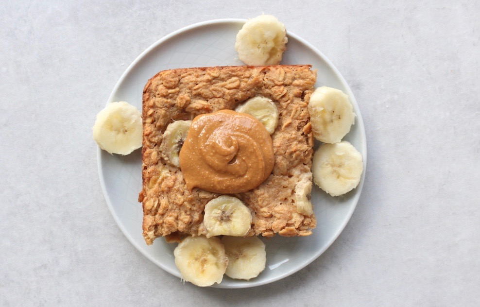 peanut butter banana baked oatmeal topped with more peanut butter and banana