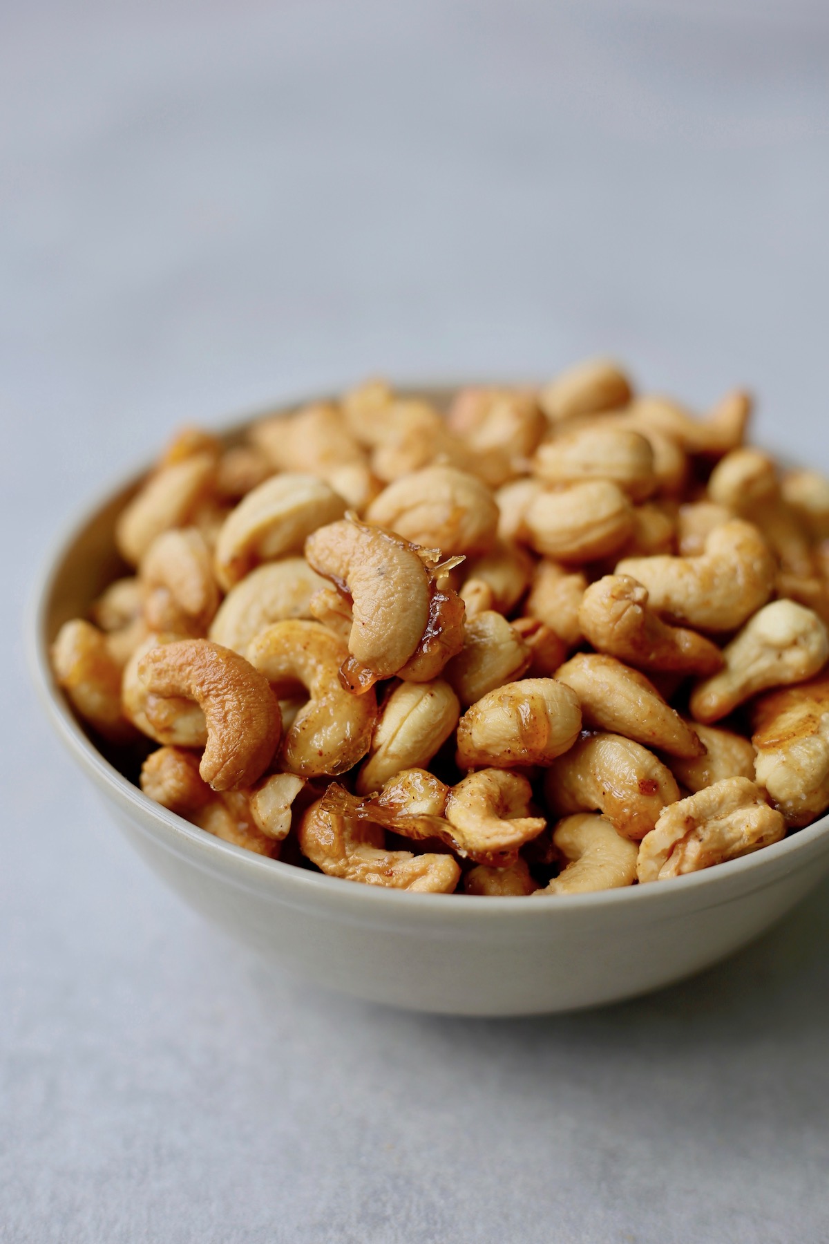 Sweet and spicy candied cashews in a bowl.