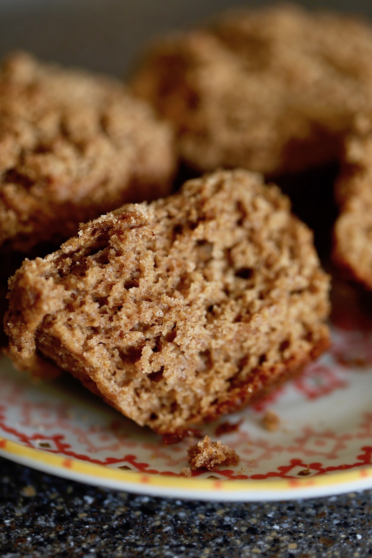 the center of fluffy vegan applesauce muffins with a crispy crumb topping