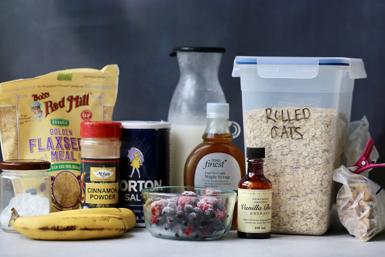 ingredients for berry baked oatmeal laid out on a table