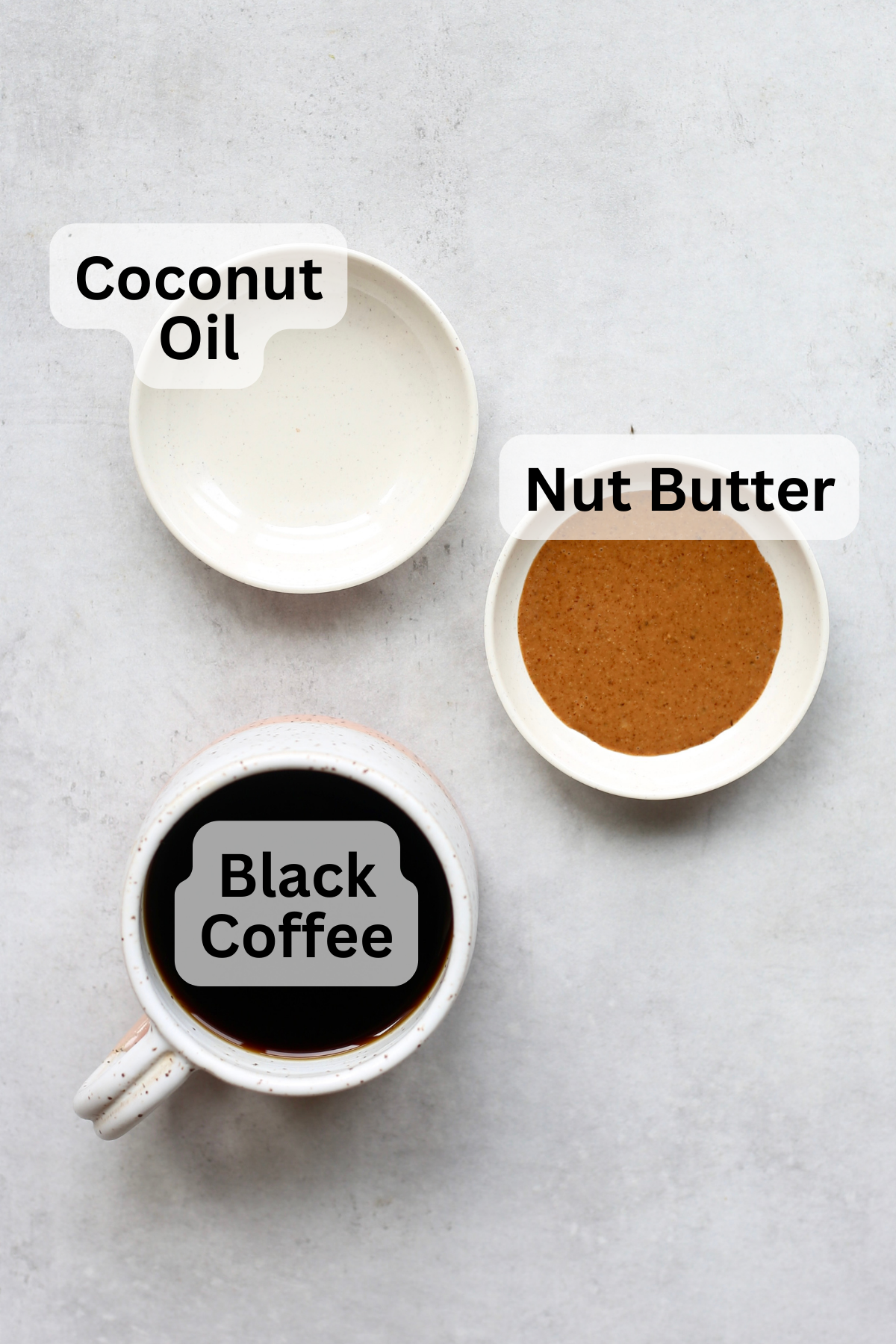 Coconut oil, almond butter, and black coffee are measured in small portions to make vegan bulletproof coffee. 