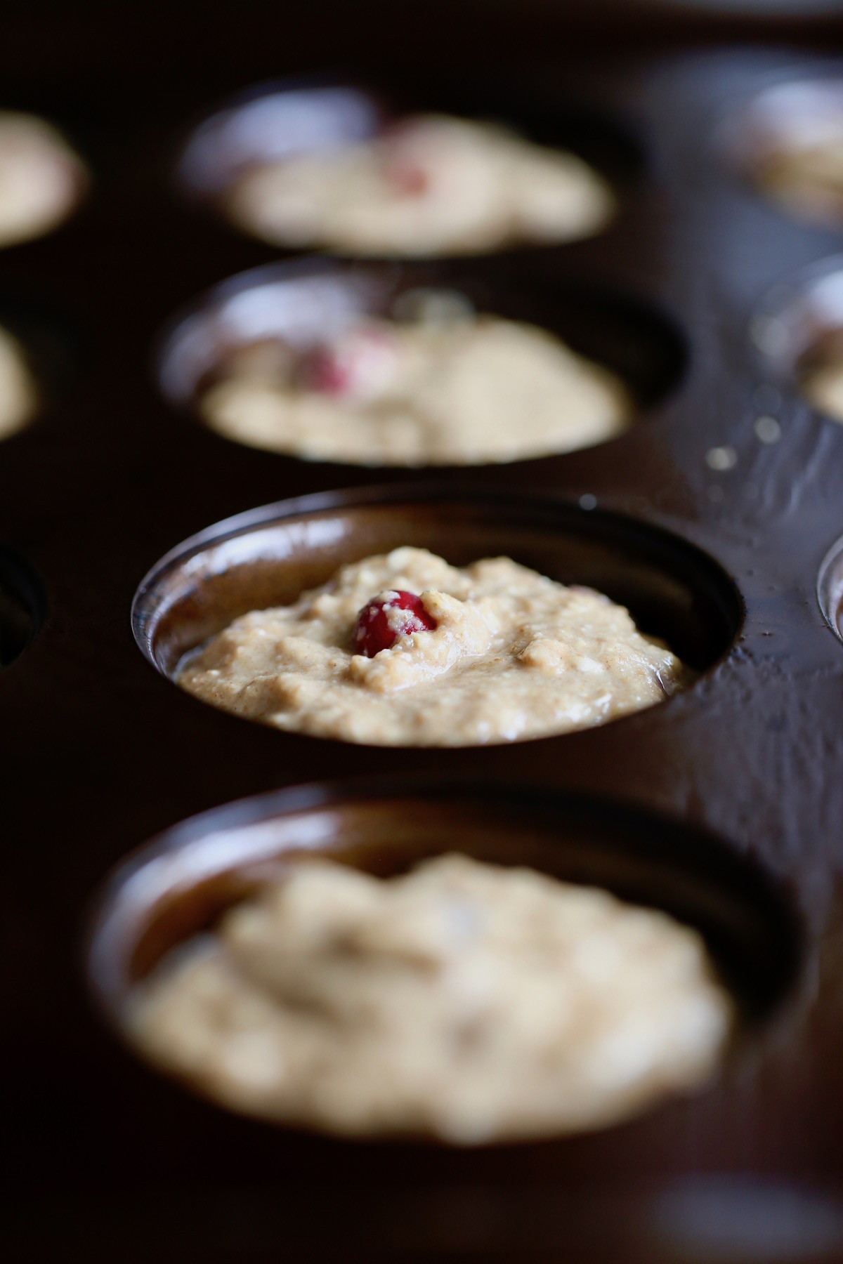 muffin batter divided between muffin 