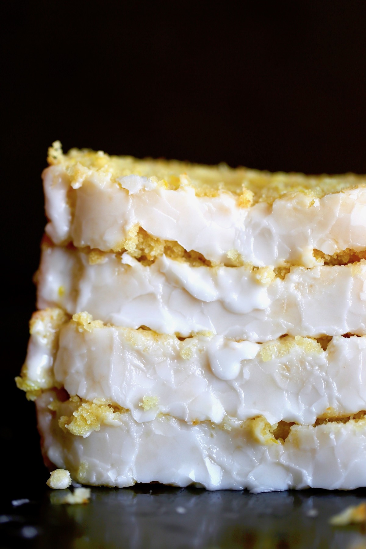 a close up of thick slices of vegan lemon loaf cake