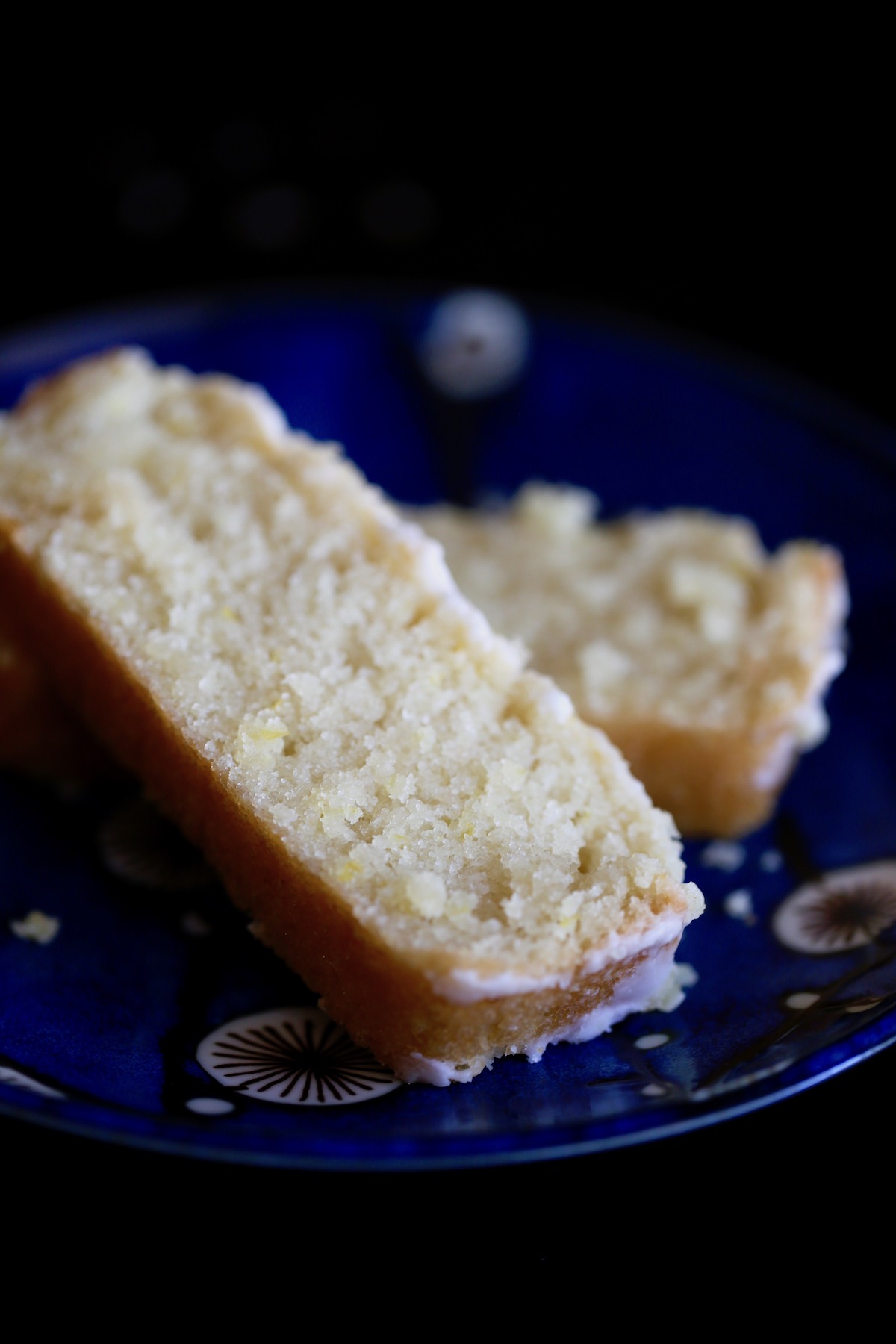 thick slices of vegan lemon cake layered on a plate
