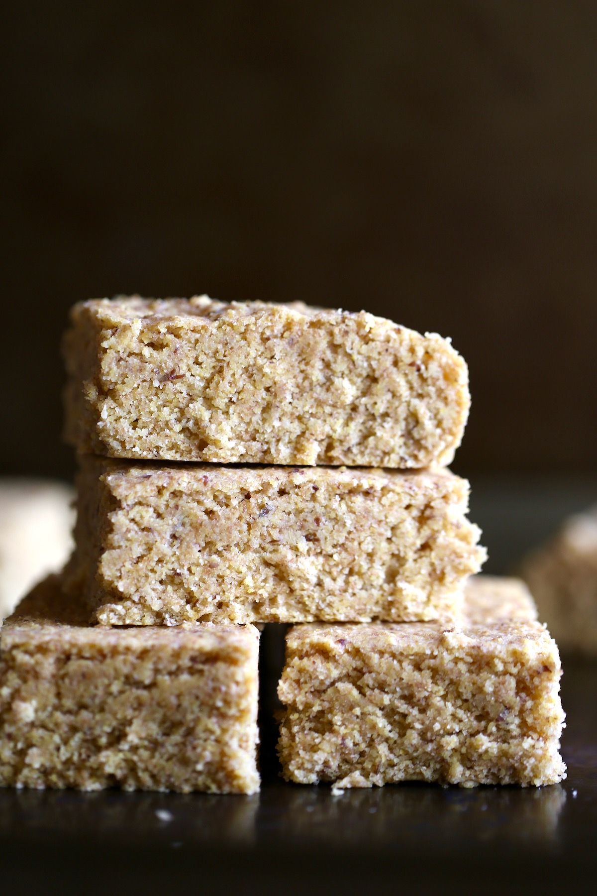 thick, fluffy squares of whole wheat vegan cornbread stacked on each other
